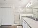 Bright bathroom featuring a glass shower enclosure, modern vanity, and sleek countertops at 6528 166Th E Pl, Parrish, FL 34219