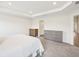 Bright bedroom with a neutral color palette, recessed lighting, and soft carpet at 6528 166Th E Pl, Parrish, FL 34219