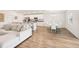 Spacious living room with dining and kitchen featuring modern decor and luxury vinyl plank flooring at 6528 166Th E Pl, Parrish, FL 34219