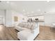 Bright living room with an open floor plan, modern furnishings, and luxury vinyl plank flooring at 6528 166Th E Pl, Parrish, FL 34219
