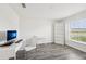 Bright office space with a large window and modern desk, chair, and bookcase at 6528 166Th E Pl, Parrish, FL 34219