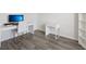 Bright office space with a modern desk, chair, and bookcase, plus luxury vinyl flooring at 6528 166Th E Pl, Parrish, FL 34219