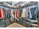 Custom walk-in closet with metal shelving, drawers, and organizational units for plenty of storage at 6845 74Th Street E Cir, Bradenton, FL 34203
