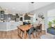 Cozy dining room with pendant lighting, wood table, and access to the kitchen at 6845 74Th Street E Cir, Bradenton, FL 34203
