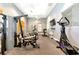 Well-equipped gym with various exercise machines, a ceiling fan, and natural light, promoting a healthy lifestyle at 6845 74Th Street E Cir, Bradenton, FL 34203