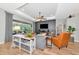Inviting living room with a ceiling fan, TV, and view of the outdoor patio at 6845 74Th Street E Cir, Bradenton, FL 34203