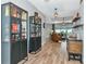 Stylish living space featuring tile floors, wet bar, and access to the outdoor living area at 6845 74Th Street E Cir, Bradenton, FL 34203