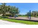 Community playground features a slide and swing set, perfect for Gathering fun and recreation at 6845 74Th Street E Cir, Bradenton, FL 34203