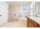 Contemporary bathroom featuring a step-in shower, garden tub, and double vanity at 7521 Aralia Way, Seminole, FL 33777