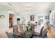 Dining room featuring a modern chandelier with seating for six at 7521 Aralia Way, Seminole, FL 33777