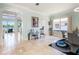 Open dining area with view to living room and access to a rear patio at 7521 Aralia Way, Seminole, FL 33777