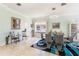 Bright dining area featuring a modern glass table and stylish chairs at 7521 Aralia Way, Seminole, FL 33777