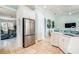 Kitchen with stainless appliances and view into dining and living rooms at 7521 Aralia Way, Seminole, FL 33777