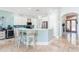 Kitchen with island, barstool seating and stainless steel appliances at 7521 Aralia Way, Seminole, FL 33777
