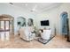 Living room with large arched openings and modern furnishings at 7521 Aralia Way, Seminole, FL 33777