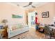 Cozy home office with hardwood floors and comfortable sofa at 7521 Aralia Way, Seminole, FL 33777