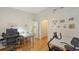 Cozy bedroom space with natural light, wooden floors, and ample space at 7604 Weeping Willow Cir, Sarasota, FL 34241