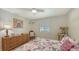 Bedroom featuring a wicker dresser, window and a cat tree at 7604 Weeping Willow Cir, Sarasota, FL 34241