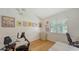 Bright bedroom featuring hardwood floors, natural light, and ample space at 7604 Weeping Willow Cir, Sarasota, FL 34241