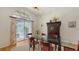 Elegant dining room with a glass-top table and a patio view at 7604 Weeping Willow Cir, Sarasota, FL 34241