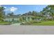 Well-maintained home with lush landscaping and a welcoming entryway at 7604 Weeping Willow Cir, Sarasota, FL 34241