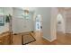 Bright foyer with hardwood floors, high ceilings, and arched doorways at 7604 Weeping Willow Cir, Sarasota, FL 34241