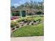 View of the home's manicured front yard, showcasing the landscaping and inviting entrance at 7604 Weeping Willow Cir, Sarasota, FL 34241