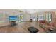 Comfortable living room offering a view of the backyard and screened pool area through sliding glass doors at 7604 Weeping Willow Cir, Sarasota, FL 34241