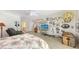 Large bedroom with eclectic decor, natural light, and ample space for personalization at 7604 Weeping Willow Cir, Sarasota, FL 34241