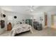 Comfortable main bedroom with natural light, hardwood floors, and ample space at 7604 Weeping Willow Cir, Sarasota, FL 34241