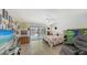 Bright main bedroom with natural light, sliding glass door, and a view of the pool at 7604 Weeping Willow Cir, Sarasota, FL 34241