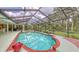 Enclosed pool providing a relaxing and private outdoor space with connection to interior living spaces at 7604 Weeping Willow Cir, Sarasota, FL 34241
