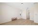 Spacious bedroom with wood-look floors and a view of the yard from the window at 7727 Heyward Cir, University Park, FL 34201