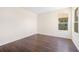 Bright bedroom featuring a window and neutral walls, perfect for creating a serene and personalized space at 7727 Heyward Cir, University Park, FL 34201