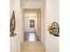Open hallway providing views into other rooms and decorative ornamentation at 7727 Heyward Cir, University Park, FL 34201