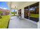 Cozy covered patio featuring a seating area, ideal for relaxing outdoors and enjoying the view at 7727 Heyward Cir, University Park, FL 34201