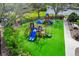Outdoor playground with blue and yellow equipment and lush green turf at 7727 Heyward Cir, University Park, FL 34201