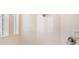 Tiled shower with shower head and window at 7727 Heyward Cir, University Park, FL 34201