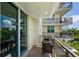 Cozy balcony with outdoor seating and city views at 800 N Tamiami Trl # 405, Sarasota, FL 34236