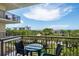 Relaxing balcony featuring patio furniture and a view of the city skyline and lush greenery at 800 N Tamiami Trl # 405, Sarasota, FL 34236