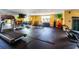 Well-lit fitness center featuring treadmills, weights, and exercise balls for a complete workout at 800 N Tamiami Trl # 405, Sarasota, FL 34236