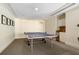 A fun-filled game room with a table tennis setup, a small kitchenette, and plenty of space to play at 800 N Tamiami Trl # 405, Sarasota, FL 34236