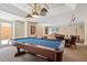 Bright game room with a pool table, TV, and comfortable seating area, perfect for entertainment at 800 N Tamiami Trl # 405, Sarasota, FL 34236
