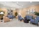 Comfortable living room with contemporary furniture and a decorative chandelier at 800 N Tamiami Trl # 405, Sarasota, FL 34236