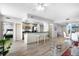 Open-concept living area featuring an island with barstool seating and modern finishes at 800 N Tamiami Trl # 405, Sarasota, FL 34236
