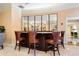 Elegant lounge area with a mirrored bar and leather bar stools at 800 N Tamiami Trl # 405, Sarasota, FL 34236