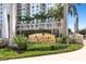 Elegant entrance sign 'Alinari at Rosemary Place' surrounded by lush landscaping at 800 N Tamiami Trl # 405, Sarasota, FL 34236