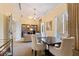 Cozy sitting area with a bookshelf, comfortable seating and a round table at 800 N Tamiami Trl # 405, Sarasota, FL 34236