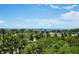 Picturesque view featuring palm trees and waterfront scenery, enhancing the property's appeal at 800 N Tamiami Trl # 405, Sarasota, FL 34236