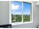 Breathtaking view of the city skyline, palm trees, and water from inside the unit at 800 N Tamiami Trl # 405, Sarasota, FL 34236